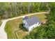Aerial view of the home featuring a driveway and fenced backyard at 5989 Zacks Mill Rd, Angier, NC 27501