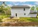 The backyard has a patio, surrounded by a chain-link fence, is perfect for entertainment at 5989 Zacks Mill Rd, Angier, NC 27501
