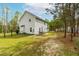 This spacious yard features a patio area ideal for outdoor entertainment and relaxation at 5989 Zacks Mill Rd, Angier, NC 27501