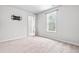 Bright bedroom with plush carpet, neutral paint, and ample natural light at 5989 Zacks Mill Rd, Angier, NC 27501