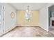 Bright dining room features neutral wall paint, modern light fixture, and tile flooring at 5989 Zacks Mill Rd, Angier, NC 27501