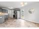 Modern kitchen with gray cabinets, stainless steel appliances, and stylish tile flooring at 5989 Zacks Mill Rd, Angier, NC 27501