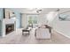 Cozy living room with fireplace, plush carpet, and abundant natural light at 5989 Zacks Mill Rd, Angier, NC 27501