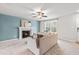 Cozy living room with fireplace and teal accent wall, offering a warm and inviting atmosphere at 5989 Zacks Mill Rd, Angier, NC 27501
