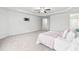 Spacious main bedroom with neutral paint, plush carpet, and tray ceiling at 5989 Zacks Mill Rd, Angier, NC 27501