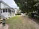 Spacious backyard featuring a shed, a sunroom, and lush greenery at 6020 Jones Farm Rd, Wake Forest, NC 27587