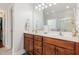 The bathroom features a double sink vanity with wood cabinets, and a framed mirror with vanity lighting at 6020 Jones Farm Rd, Wake Forest, NC 27587