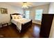 Cozy bedroom with neutral paint, natural light, and hardwood floors at 6020 Jones Farm Rd, Wake Forest, NC 27587