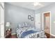 Comfortable bedroom featuring natural light, a ceiling fan, and hardwood flooring at 6020 Jones Farm Rd, Wake Forest, NC 27587