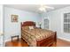 Cozy bedroom with a ceiling fan, hardwood floors, and a window at 6020 Jones Farm Rd, Wake Forest, NC 27587