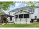 Exterior view of a home showcasing the screened-in porch and landscaped yard at 6020 Jones Farm Rd, Wake Forest, NC 27587