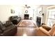 Comfortable living room with a fireplace, plush seating, and a large area rug on hardwood floors at 6020 Jones Farm Rd, Wake Forest, NC 27587