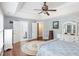Spacious main bedroom features tray ceiling, wood floors, and access to the bathroom and closet at 6020 Jones Farm Rd, Wake Forest, NC 27587