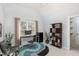 Bright home office features a desk, chair, shelving, and large window for plenty of natural light at 6020 Jones Farm Rd, Wake Forest, NC 27587