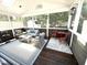 Sunroom features two seating areas, one for dining and one for conversation at 6020 Jones Farm Rd, Wake Forest, NC 27587