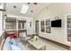 Cozy sunroom with comfortable seating, a skylight, and a flat-screen television at 6020 Jones Farm Rd, Wake Forest, NC 27587