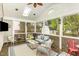Cozy sunroom with wicker furniture, wood paneled walls and lots of light at 6020 Jones Farm Rd, Wake Forest, NC 27587