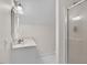 Bathroom featuring a glass door walk-in shower, modern fixtures, and neutral colors at 615 Woodland Trl, Louisburg, NC 27549
