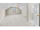 Large carpeted bonus room with a window and access to a bathroom at 615 Woodland Trl, Louisburg, NC 27549