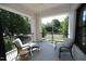 Inviting covered balcony with tiled floor and comfortable seating area at 620 Wade Ave # 206, Raleigh, NC 27605