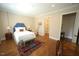 Comfortable bedroom with hardwood floors, neutral walls and natural light at 620 Wade Ave # 206, Raleigh, NC 27605