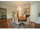 Dining area showcasing hardwood floors, chandelier, and elegant decor at 620 Wade Ave # 206, Raleigh, NC 27605