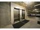 Elevators in the underground parking garage near parked luxury SUVs at 620 Wade Ave # 206, Raleigh, NC 27605