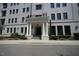 Close up of building entrance featuring pillars and landscaping at 620 Wade Ave # 206, Raleigh, NC 27605