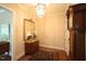 Inviting entryway with hardwood floors, decorative mirror, antique furniture and area rug at 620 Wade Ave # 206, Raleigh, NC 27605