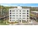 Stately multi-story building features balconies, manicured landscaping and convenient street parking at 620 Wade Ave # 206, Raleigh, NC 27605