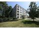 Beautiful low angle exterior of building with well-manicured lawn and greenery at 620 Wade Ave # 206, Raleigh, NC 27605