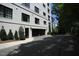 A building exterior showing a garage door, side door, and brick at 620 Wade Ave # 206, Raleigh, NC 27605