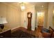 Inviting foyer with hardwood floors, grandfather clock, and elegant lighting fixture at 620 Wade Ave # 206, Raleigh, NC 27605