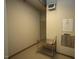 A utility cart and trash disposal in a hallway at 620 Wade Ave # 206, Raleigh, NC 27605