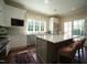 Modern kitchen featuring a large island, stainless steel appliances, and lots of natural light at 620 Wade Ave # 206, Raleigh, NC 27605