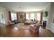 Bright living room with a fireplace, hardwood flooring, and access to the outdoor space at 620 Wade Ave # 206, Raleigh, NC 27605
