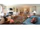 Open-concept living area with fireplace, built-ins, hardwood floors, and view to dining room at 620 Wade Ave # 206, Raleigh, NC 27605