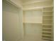 Spacious walk-in closet with shelves and racks for optimal organization at 620 Wade Ave # 206, Raleigh, NC 27605