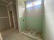 A bathroom with an unfinished shower, small window, and drywall at 70 Valebrook Ct, Youngsville, NC 27596