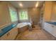 Bright bathroom with large windows, tile shower, and double sink vanity at 70 Valebrook Ct, Youngsville, NC 27596