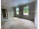 A bedroom with drywall and two windows providing ample natural light at 70 Valebrook Ct, Youngsville, NC 27596