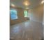 Bright bedroom featuring two windows offering ample natural light at 70 Valebrook Ct, Youngsville, NC 27596