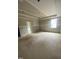Bedroom featuring tray ceiling, drywall and window for natural light at 70 Valebrook Ct, Youngsville, NC 27596