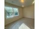 Well-lit bedroom featuring a large window with backyard views at 70 Valebrook Ct, Youngsville, NC 27596