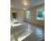 Bedroom with carpet covered in plastic, two windows offering natural light at 70 Valebrook Ct, Youngsville, NC 27596