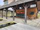 Charming boat house featuring kayaks and outdoor seating, perfect for waterfront living at 70 Valebrook Ct, Youngsville, NC 27596