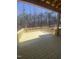 A spacious, newly constructed wood deck with railings offers views of the surrounding forest at 70 Valebrook Ct, Youngsville, NC 27596
