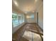 Elegant dining room featuring large windows, a modern chandelier, and wainscoting, awaiting your personal touch at 70 Valebrook Ct, Youngsville, NC 27596