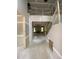 Unfinished foyer with staircase and visible doorway leading to other parts of the house at 70 Valebrook Ct, Youngsville, NC 27596
