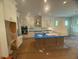 Spacious kitchen with white cabinets, a large island, and stainless steel appliances, perfect for culinary enthusiasts at 70 Valebrook Ct, Youngsville, NC 27596